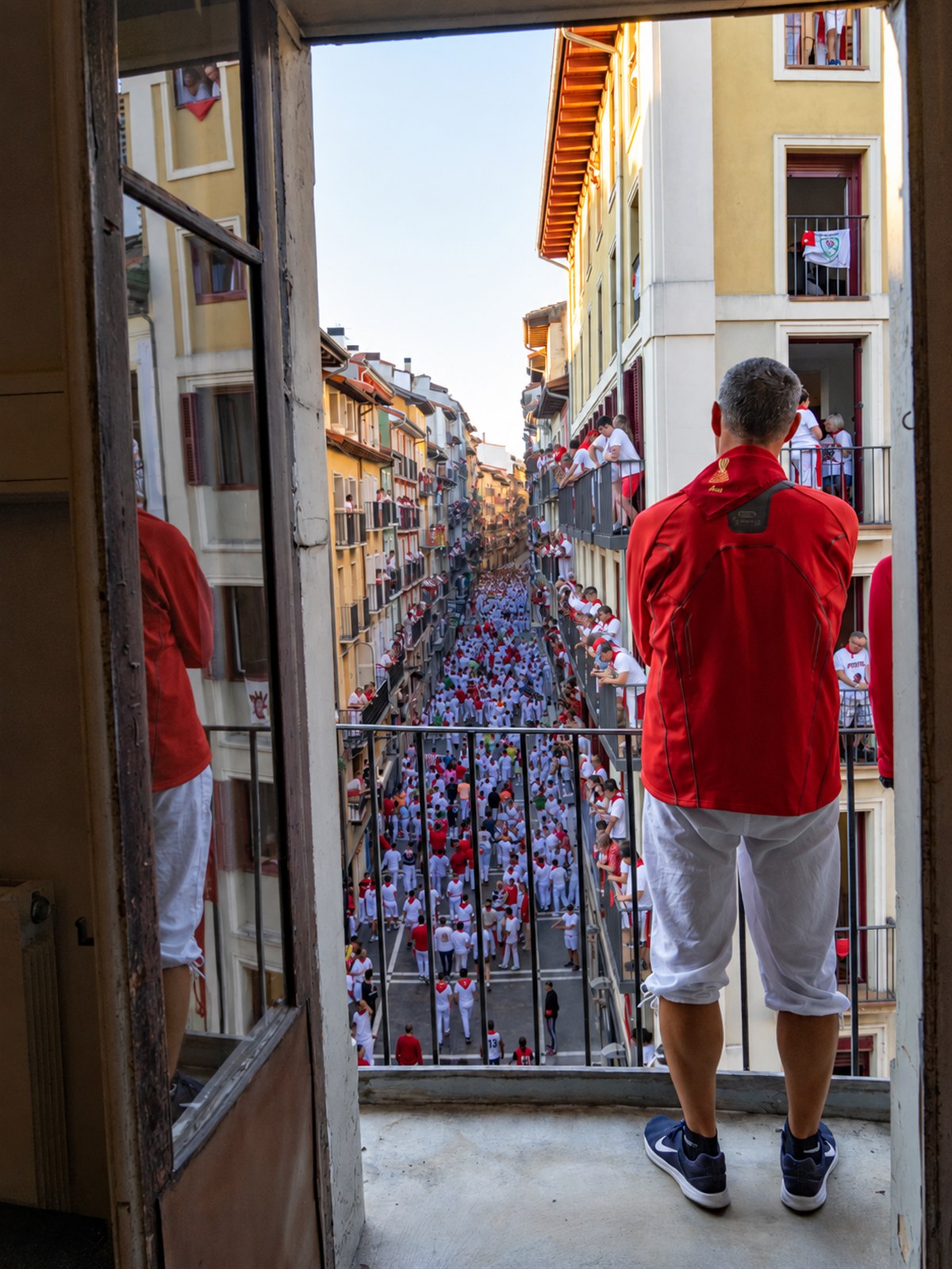 The San Fermín Running of the Bulls seen from a balcony in Pamplona